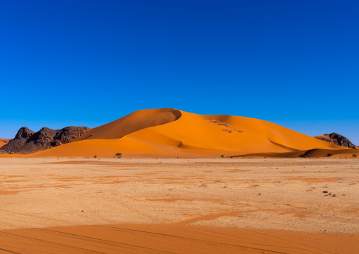 Rocks and sand dunes in Sahara desert, Tassili N'Ajjer National Park, Tadrart Rouge, Algeria