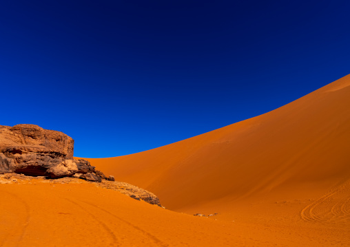 Rocks and sand dunes in Sahara desert, Tassili N'Ajjer National Park, Tadrart Rouge, Algeria