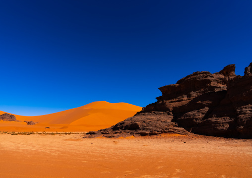 Rocks and sand dunes in Sahara desert, Tassili N'Ajjer National Park, Tadrart Rouge, Algeria