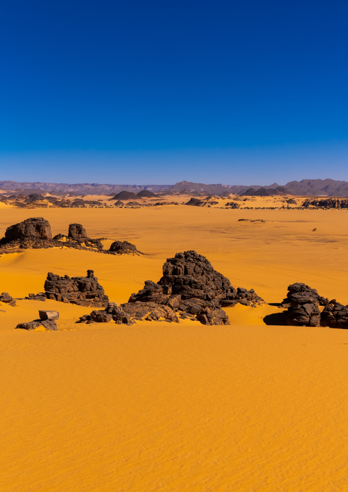 Rocks and sand dunes in Sahara desert, North Africa, Erg Admer, Algeria