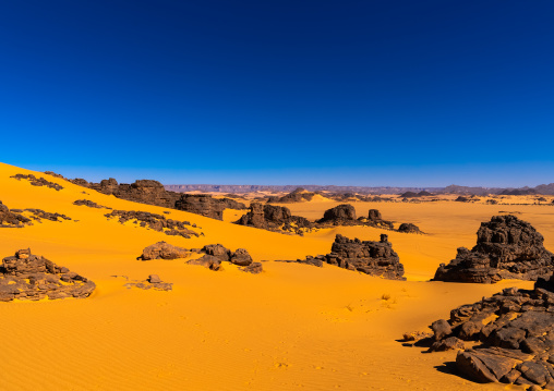 Rocks and sand dunes in Sahara desert, North Africa, Erg Admer, Algeria