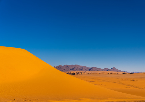 Rocks and sand dunes in Sahara desert, North Africa, Erg Admer, Algeria