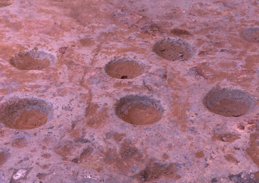 Holes to grind grains in Ksar El Atteuf, North Africa, Ghardaia, Algeria