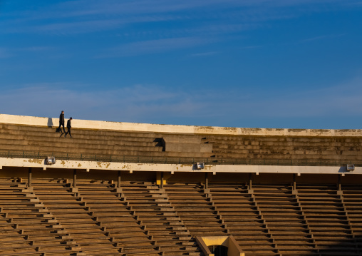 Men walking in the arena rows, North Africa, Oran, Algeria