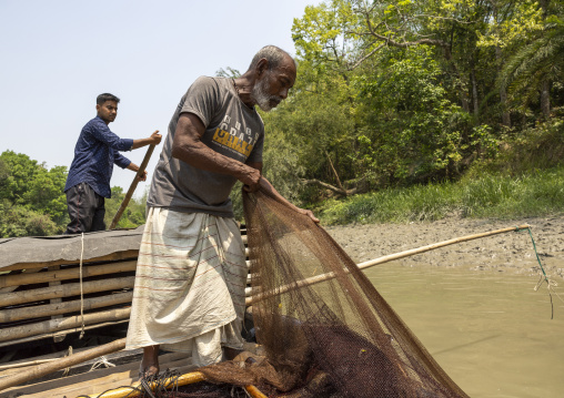 Bangladeshi fishermen use otters to fish in the Sundarbans, Khulna Division, Narail Sadar, Bangladesh