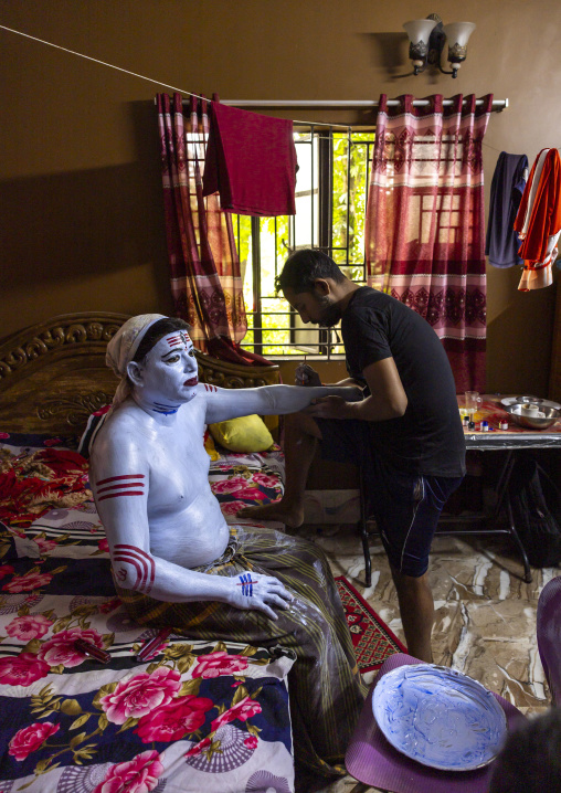 Make up of a hindu devotee who becomes Lord Shiva at Lal Kach festival, Dhaka Division, Munshiganj, Bangladesh