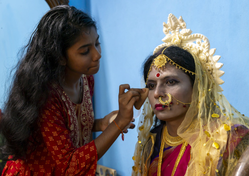 Make up of Parvati wife of Lord Shiva played by a man during Lal Kash festival, Dhaka Division, Munshiganj, Bangladesh