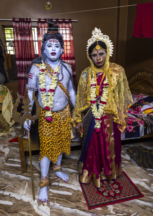 Lord Shiva and Parvati wife played by a man during Lal Kash festival, Dhaka Division, Munshiganj, Bangladesh