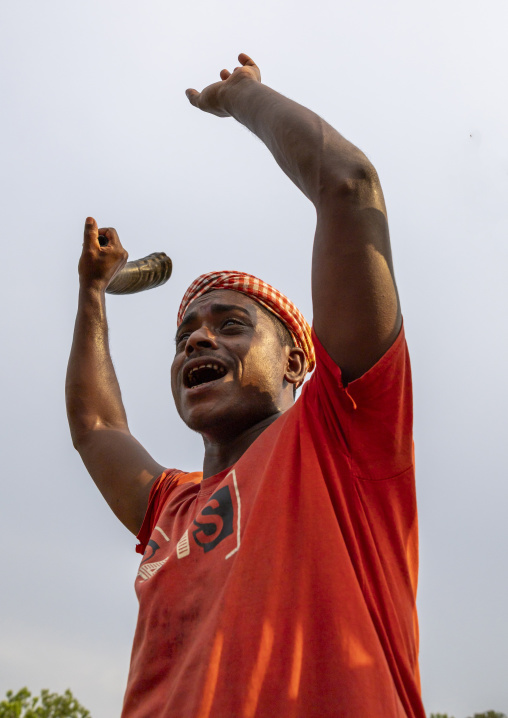 Devotee with a horn during Charak Puja hindu festival, Sylhet Division, Kamalganj, Bangladesh