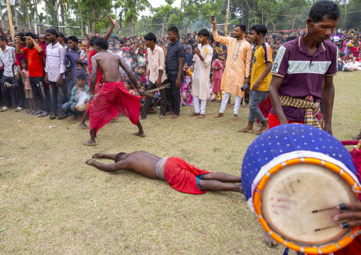 Devotte lying on the ground during Charak Puja hindu festival, Sylhet Division, Kamalganj, Bangladesh