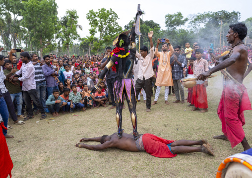 Kali standing on the back of lying man Charak Puja hindu festival, Sylhet Division, Kamalganj, Bangladesh