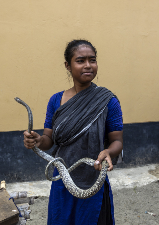 Gypsy woman with snake she rents for ceremonies, Chittagong Division, Bijoynagar, Bangladesh