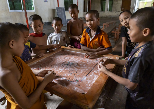 Orphans boys playing carrom in Shalban Buddhist Monastery, Chittagong Division, Comilla, Bangladesh
