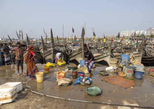 Bangladeshi man selling fishes in fish market, Chittagong Division, Chittagong, Bangladesh