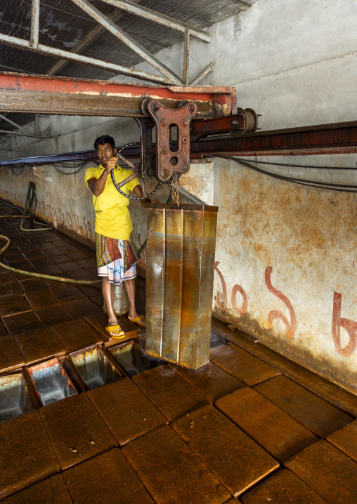 Bangladeshi man working in an ice factory in the fish market, Chittagong Division, Chittagong, Bangladesh