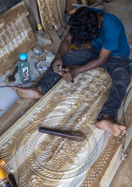 Wood carver in his workshop, Chittagong Division, Bandarban, Bangladesh