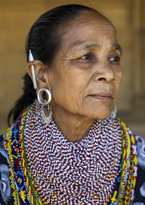 Portrait of a Tripura tribe woman with traditional necklaces and earrings, Chittagong Division, Rowangchhari, Bangladesh