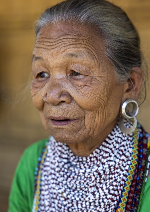 Portrait of a Tripura tribe woman with traditional necklaces and earrings, Chittagong Division, Rowangchhari, Bangladesh