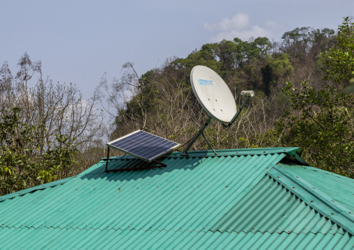 Solar panel and satellite dish in a Tripura tribe village, Chittagong Division, Rowangchhari, Bangladesh