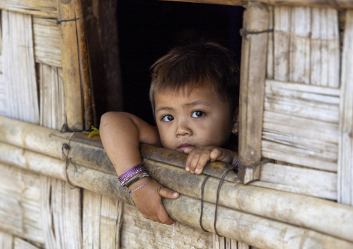 Murong ethnic group girl in the window of a bamboo house, Chittagong Division, Bandarban, Bangladesh