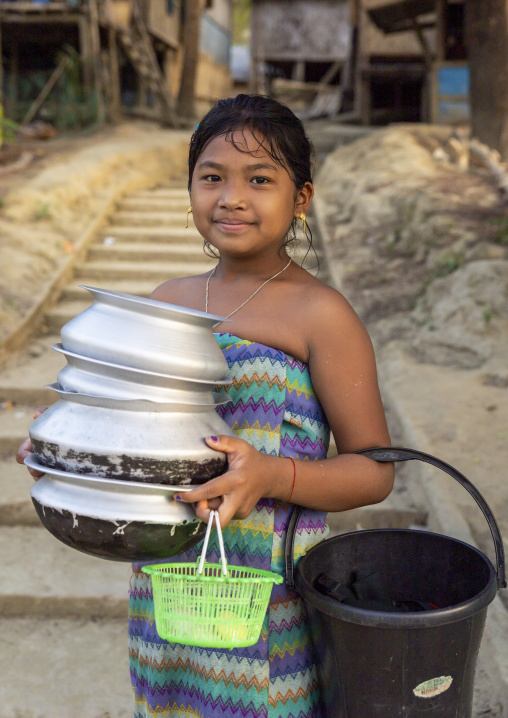 Marma ethnic group girl back from the river after taking a bath, Chittagong Division, Rowangchhari, Bangladesh