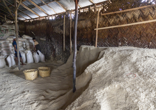 Bangladeshi workers packing salt in bags in a factory, Chittagong Division, Chittagong, Bangladesh