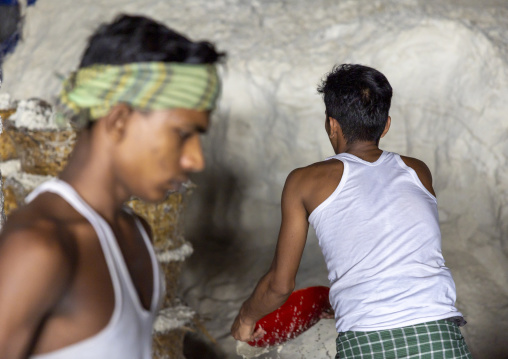 Bangladeshi men working in a salt factory, Chittagong Division, Chittagong, Bangladesh
