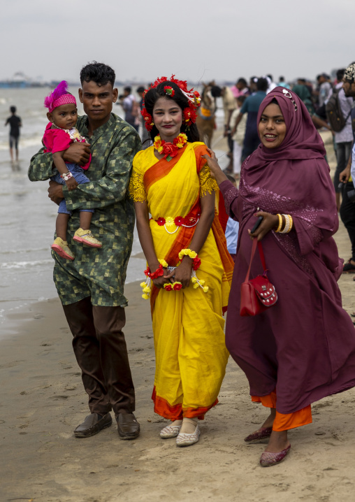 Bangladeshi family relaxing on the beach, Chittagong Division, Chittagong, Bangladesh