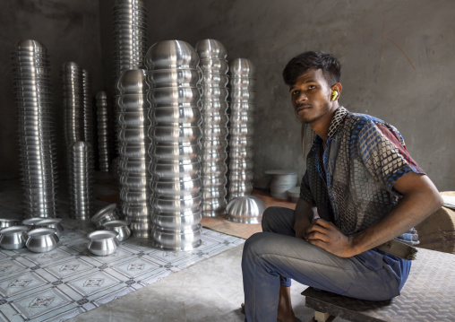Bangladeshi man in a metal bowls factory stock, Dhaka Division, Dhaka, Bangladesh