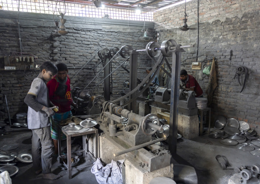 Bangladeshi workers making metal bowls, Dhaka Division, Dhaka, Bangladesh
