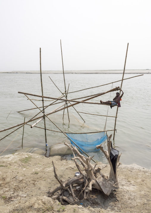 Traditional fishing net which functions on the principle of balance, Dhaka Division, Shivalaya, Bangladesh