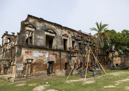 Rusty merry-go-round near Teota Zamindar Bari, Dhaka Division, Shivalaya, Bangladesh