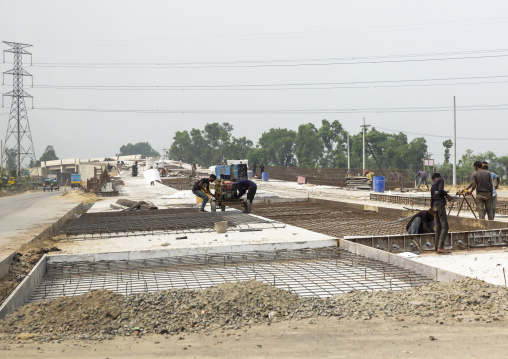 Workers at a road construction site, Rajshahi Division, Bogura, Bangladesh