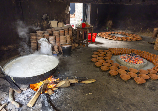 Clay pots around a bonfire to make traditional yogurt, Rajshahi Division, Bogura, Bangladesh