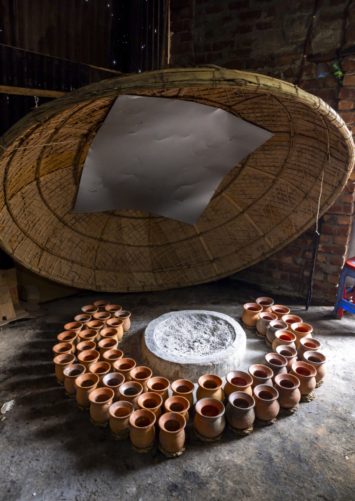 Clay pots around a bonfire to make traditional yogurt, Rajshahi Division, Bogura, Bangladesh