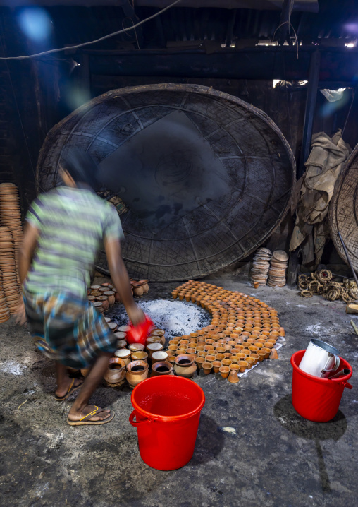 Clay pots around a bonfire to make traditional yogurt, Rajshahi Division, Bogura, Bangladesh