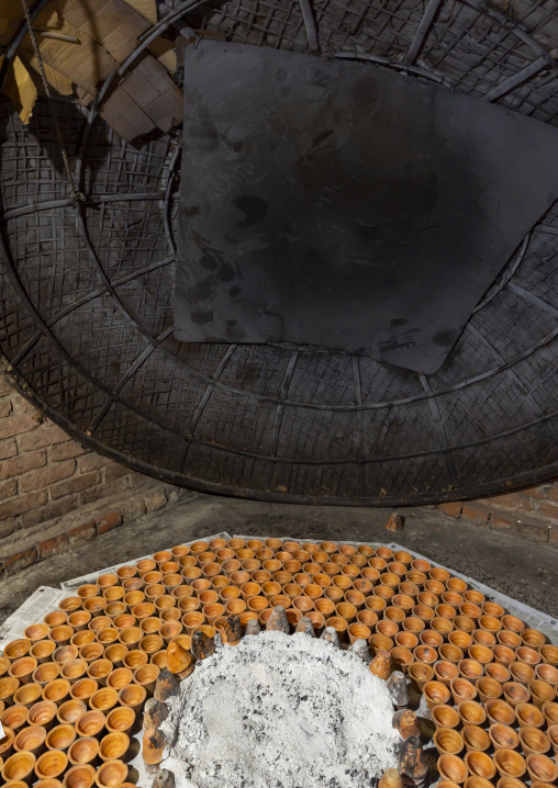 Clay pots around a bonfire to make traditional yogurt, Rajshahi Division, Bogura, Bangladesh