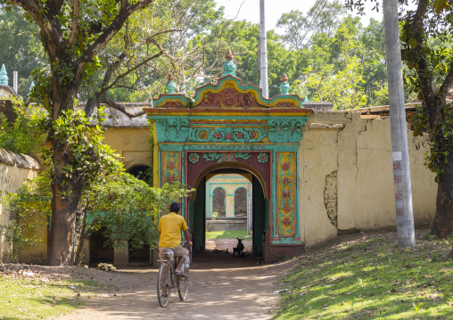 Man on bicycle entering the Hindu temple in Dinajpur Rajbari, Rajshahi Division, Dinajpur, Bangladesh