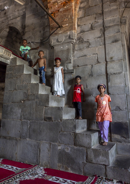 Children on the stairs of the Kusumba Mosque, Rajshahi Division, Kusumba, Bangladesh