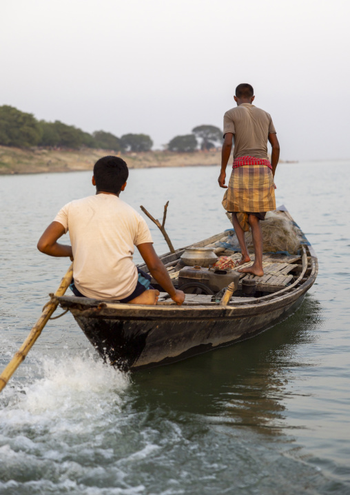 Bangladeshi fishermen on their boat, Rajshahi Division, Rajshahi, Bangladesh