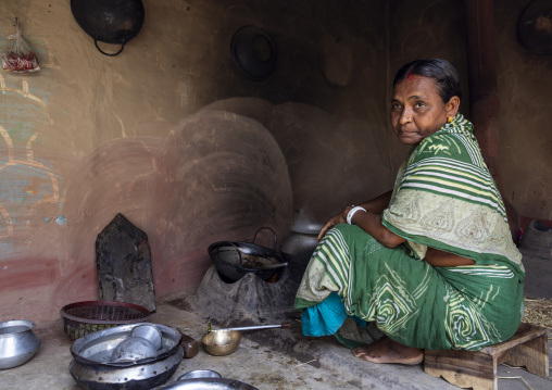Bangladeshi woman cooking in her kitchen, Rajshahi Division, Tikoil, Bangladesh