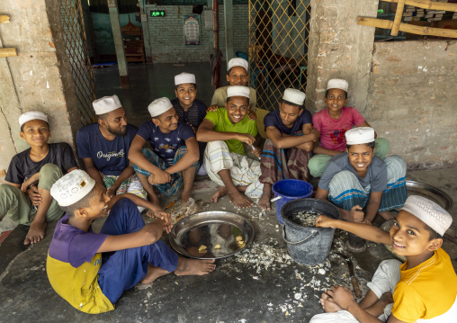 Bangladeshi muslim boys in a madrassa cooking, Rajshahi Division, Puthia, Bangladesh