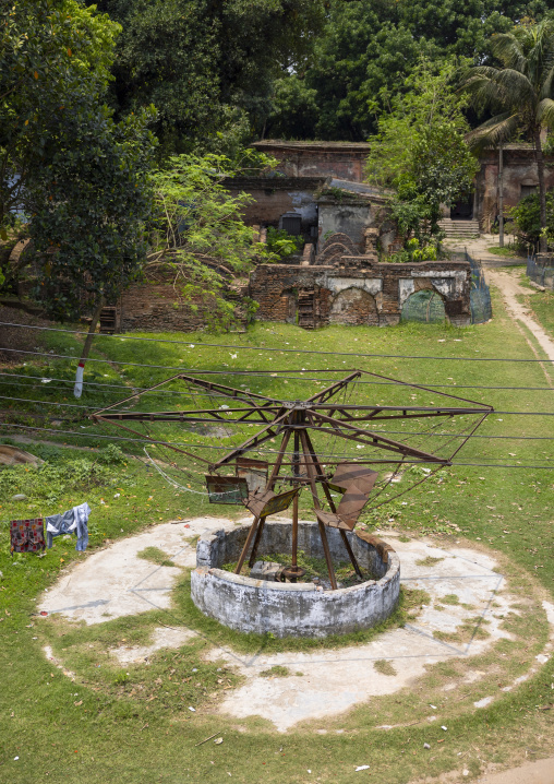 Old rusty merry-go-round in Natore Rajbari gardens, Rajshahi Division, Natore, Bangladesh