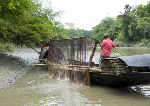 Bangladeshi fishermen use otters to fish in the Sundarbans, Khulna Division, Narail, Bangladesh