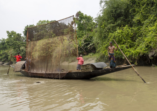 Bangladeshi fishermen use otters to fish in the Sundarbans, Khulna Division, Narail, Bangladesh