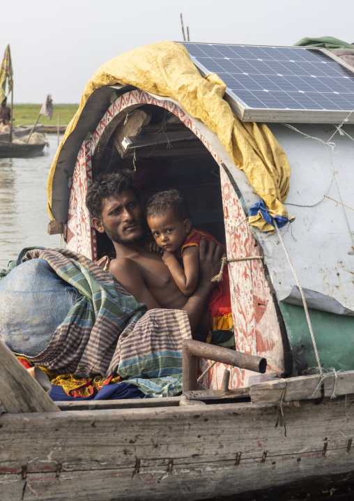 River gypsy father and daughter living on a boat , Barisal Division, Barisal, Bangladesh