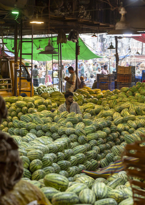 Bangladeshi man selling watermelons at Kawran Bazar market, Dhaka Division, Dhaka, Bangladesh