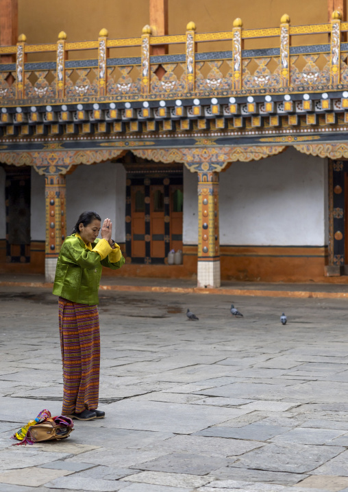 Bhutanese woman praying in Nyenzer Lhakhang, Punakha dzongkhag, Punakha, Bhutan