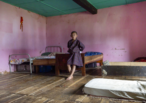 Bhutanese novice monk in Nyenzer Lhakhang dormitory, Thedtsho Gewog, Wangdue Phodrang, Bhutan