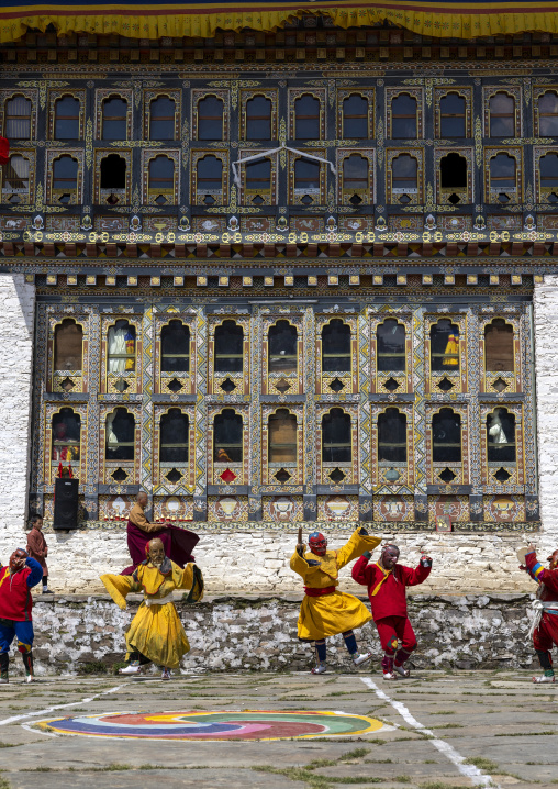 Masked atsaras  at the annual Ura Yakchoe festival, Bumthang, Ura, Bhutan